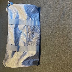 Silver Reebok duffel bag for gym or other uses